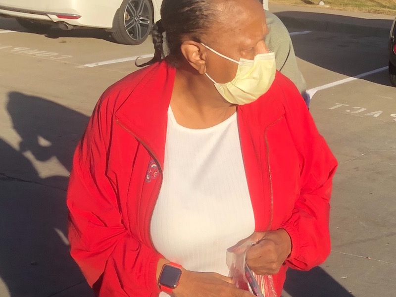 Woman in Red Jacket with Face Mask